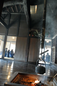 Thatched-roof houses are regularly needed to be smoked to protect from incests. That's why they alway have fireplace inside the room.